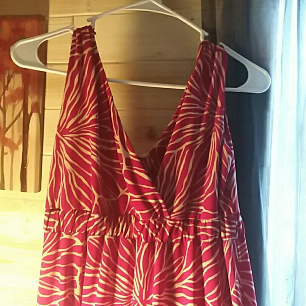 Red and cream colored mid length floral dress